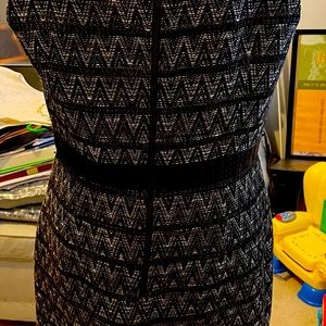 Multi color dress with leather accents at the collar and waist.